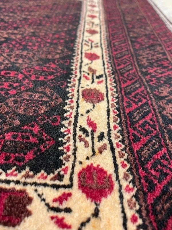 Handmade wool rug – Afghan/Baluch style – 180 × 102 cm – burgundy/black & ivory border — photograph 7