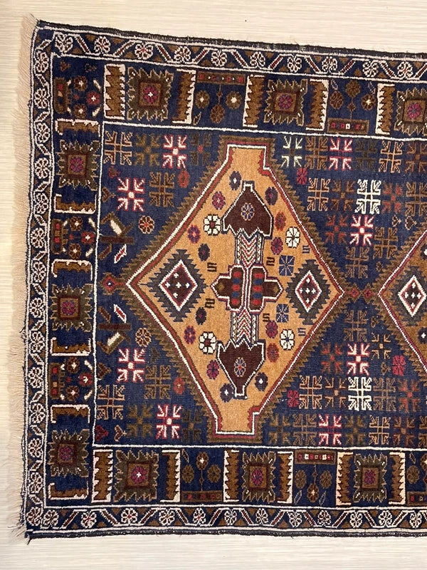 Hand-knotted tribal rug – navy & sand medallions – 197 × 108 cm — photograph 4