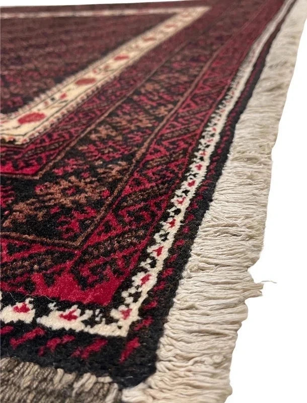 Handmade wool rug – Afghan/Baluch style – 180 × 102 cm – burgundy/black & ivory border — photograph 5