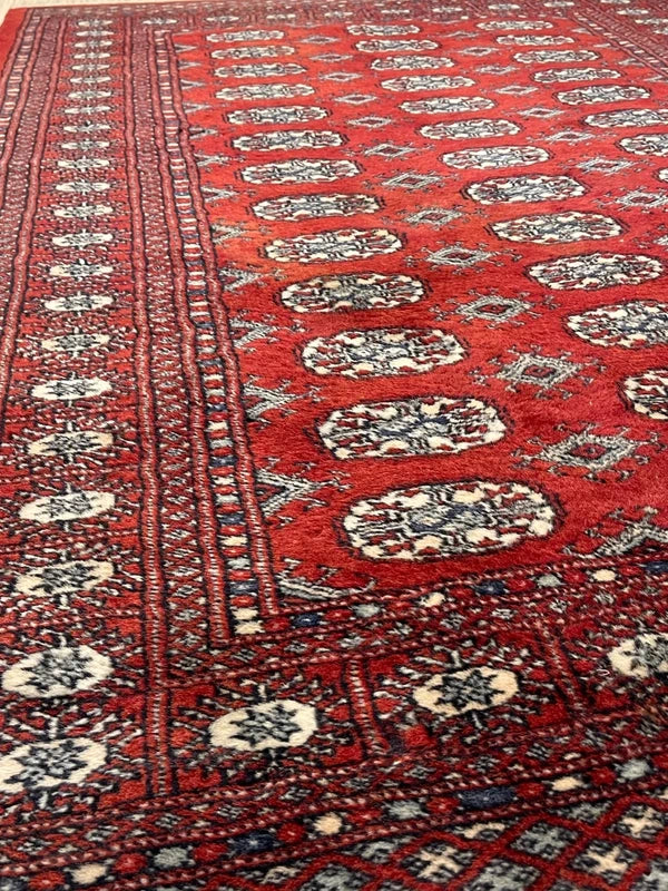 Hand knotted Red Bokhara / Turkoman style rug 186 x 130 cm – cream & navy motifs — photograph 4