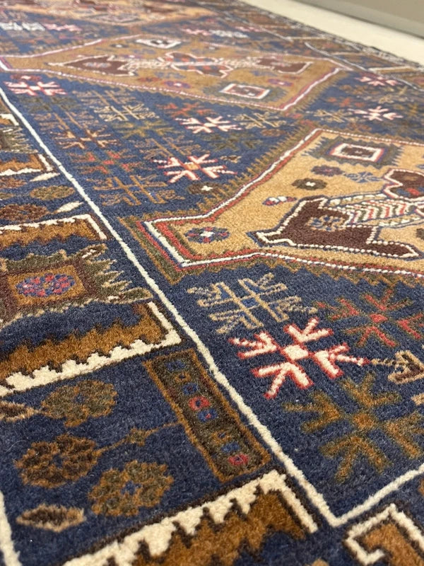 Hand-knotted tribal rug – navy & sand medallions – 197 × 108 cm — photograph 3