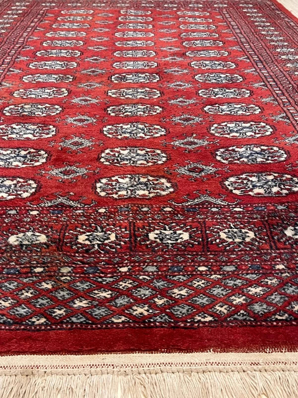 Hand knotted Red Bokhara / Turkoman style rug 186 x 130 cm – cream & navy motifs — photograph 6