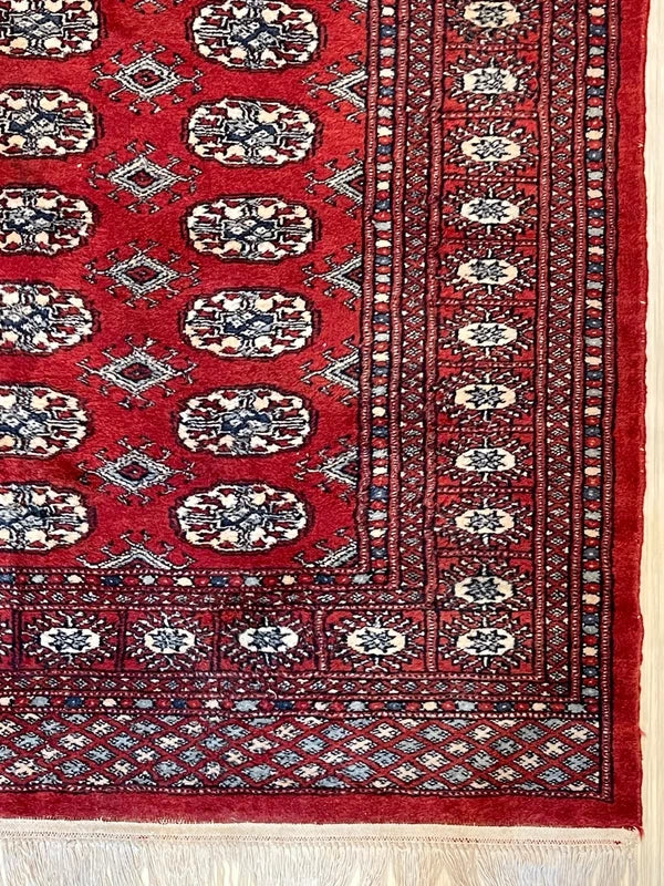 Hand knotted Red Bokhara / Turkoman style rug 186 x 130 cm – cream & navy motifs — photograph 3