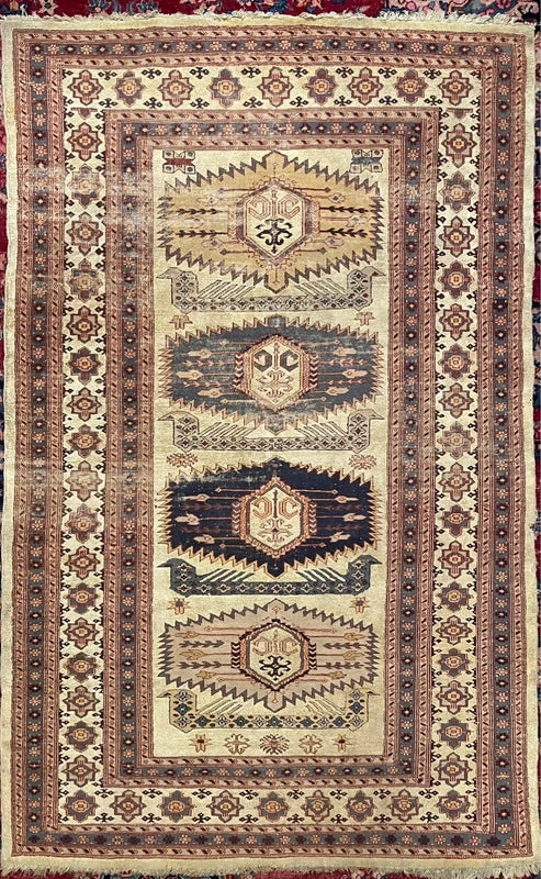 Hand-knotted wool rug with silk highlights – neutral geometric medallions – 184 × 122 cm — photograph 1