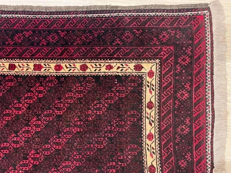 Handmade wool rug – Afghan/Baluch style – 180 × 102 cm – burgundy/black & ivory border — photograph 8