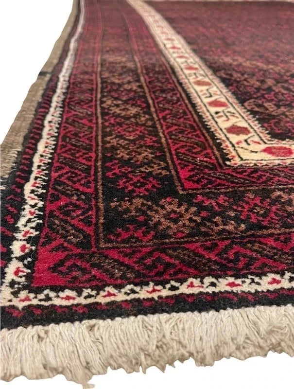 Handmade wool rug – Afghan/Baluch style – 180 × 102 cm – burgundy/black & ivory border — photograph 6
