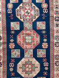 Vintage geometric wool rug, Turkish/Caucasian style 230 x 145 cm — photograph 1