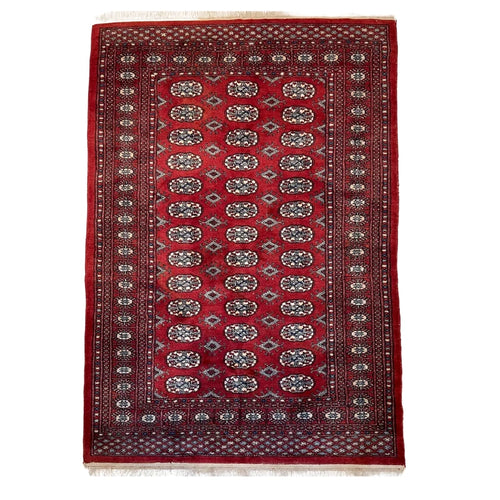 Hand knotted Red Bokhara / Turkoman style rug 186 x 130 cm – cream & navy motifs — photograph 1