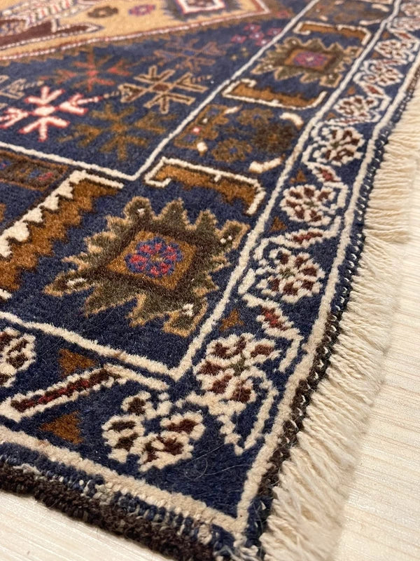 Hand-knotted tribal rug – navy & sand medallions – 197 × 108 cm — photograph 8